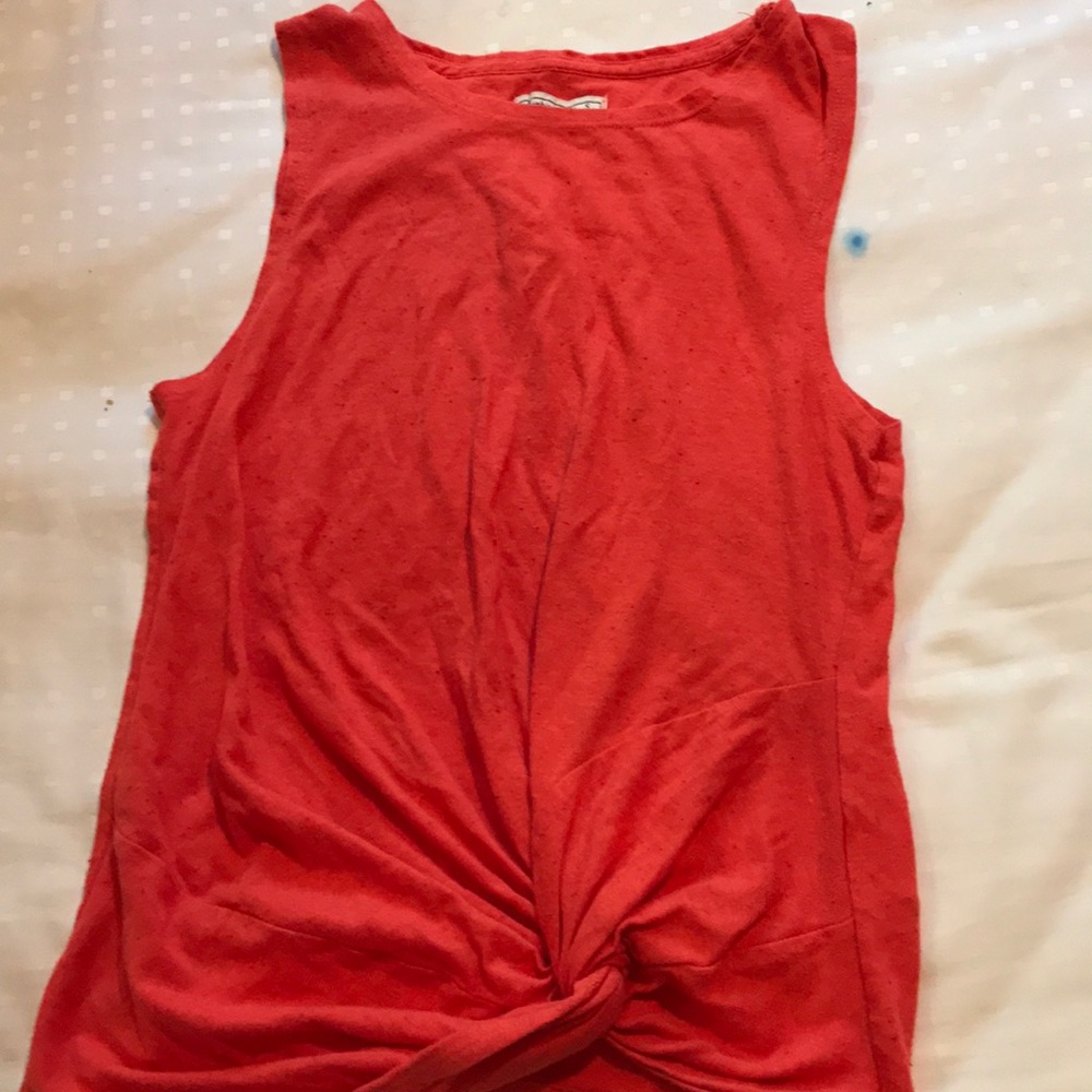 A reddish orange tank top. Barely worn.
